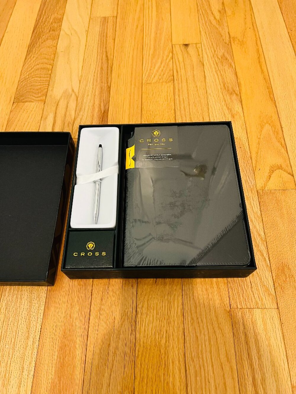 Cross gift set features a slim chrome ballpoint pen paired with a black journal - Picture 2 of 4